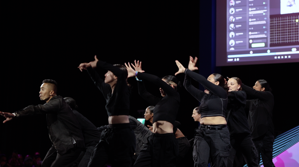 Founder of StageKeep, Axel Villamil on stage at Collision Conference 2022 with dancers